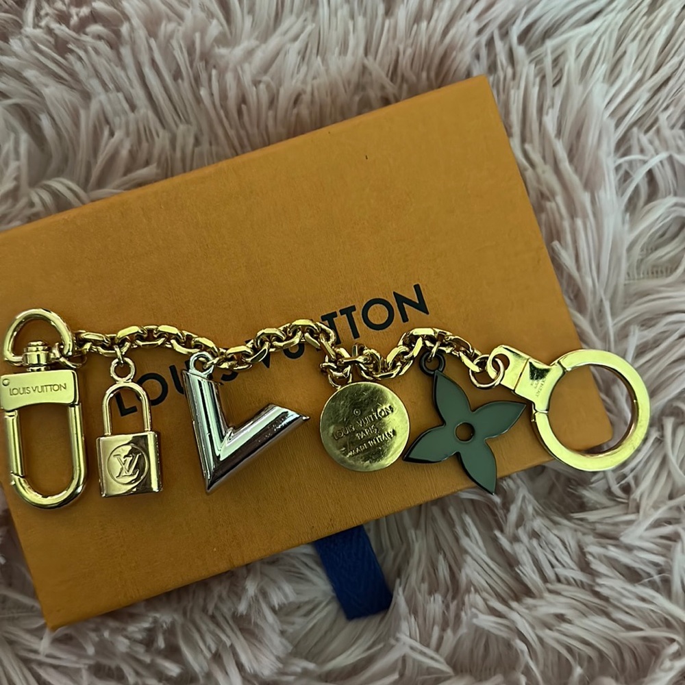 Louis Vuitton purse charm.